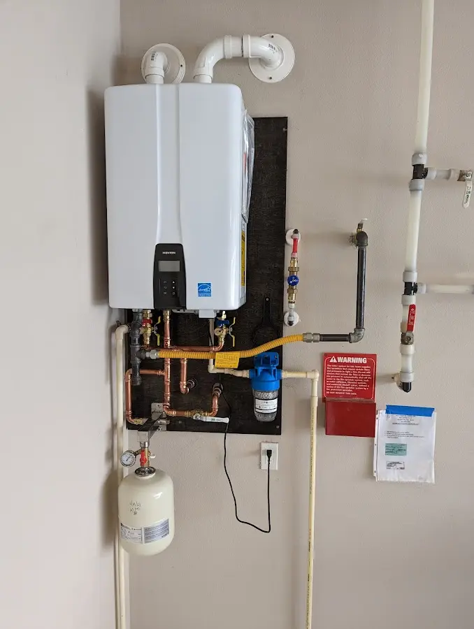 Professional plumber installing copper piping in a Kingsbury home